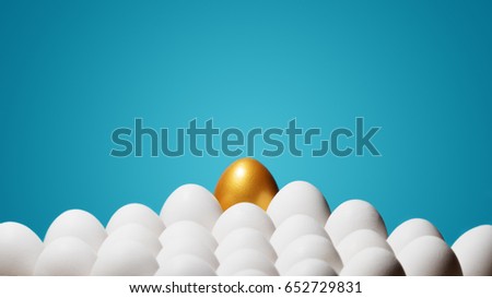 Concept of individuality, exclusivity, better choice. One golden egg among white eggs on blue background.