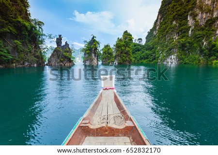 Natural attractions from a long-tailed boat in Ratchaprapha Dam at Khao Sok National Park, Suratthani Province, Thailand. Royalty-Free Stock Photo #652832170