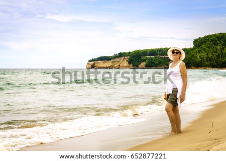 Happy mature woman on a beach on Upper Peninsula, Michigan