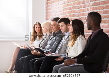 Group Of Diverse People Waiting For Job Interview In Office Royalty-Free Stock Photo #652926397
