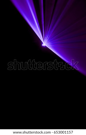 Laser beam purple on a black background 