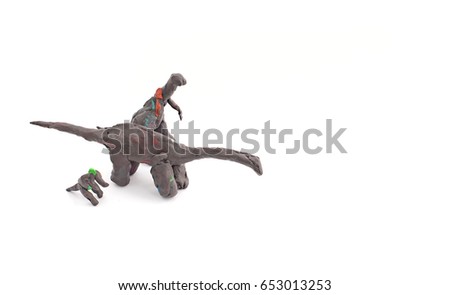 Dinosaur from plasticine on a white background. The clay modelling. Children's art, hobby