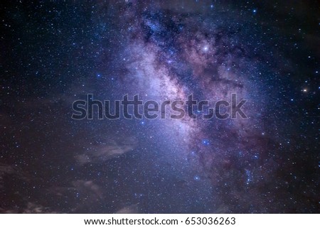 Night landscape with colorful blurry vision Milky Way and yellow light .Starry sky with hills at summer. Beautiful Universe. Space background