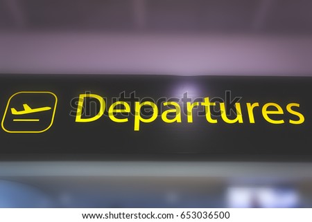 Information sign showing way to departure gates at  airport 