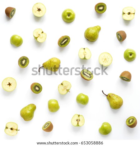 Vegetables and fruits on a white background. Pattern of vegetables and fruits. Food background. Collage of food. Top view.  Composition from pears, green apples, kiwi. Royalty-Free Stock Photo #653058886