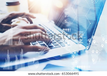 Closeup view of Male hand typing on laptop keyboard.Businessman working at office on modern notebook.Concept of digital diagram,graph interfaces,virtual screen,connections icon.Blurred Royalty-Free Stock Photo #653066491