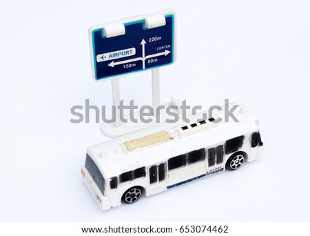OLD MODEL TOY , PUBLIC BUS WITH DIRECTION SIGN , ISOLATED WHITE BACKGROUND