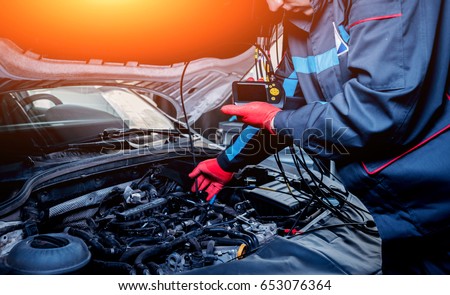 Video investigate. Engine diagnostics. Car repair. Service station. Royalty-Free Stock Photo #653076364