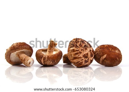 Fresh Shiitake mushroom  isolated on white background. Royalty-Free Stock Photo #653080324