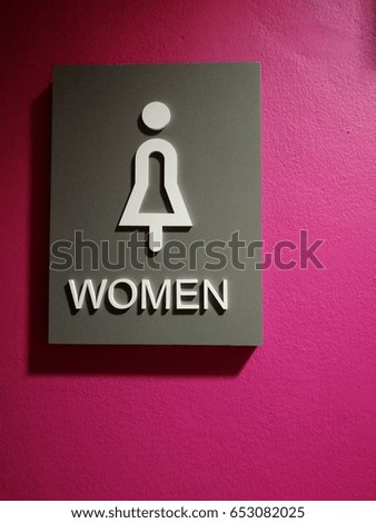 toilet sign for women in pink background 