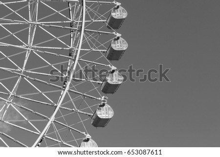Black and White, Large Ferris wheel in amusement Park close up 