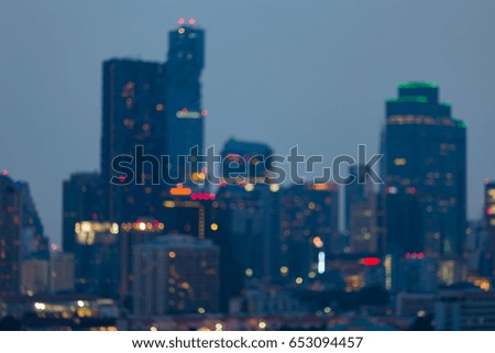 City blurred bokeh light office building night view, abstract background