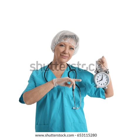 Medical doctor woman with stethoscope and alarm click isolated on white background