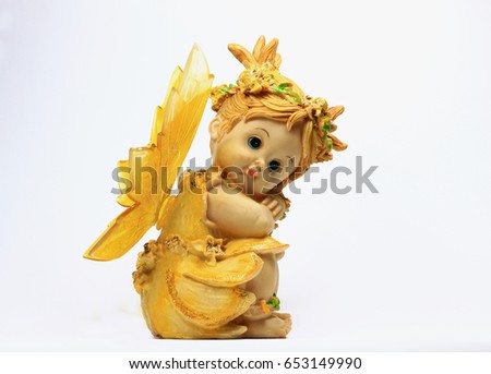 Lovely angel resin doll isolated on withe background