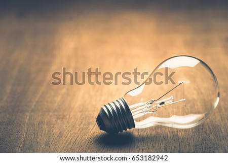 Light bulb on wood with copy space