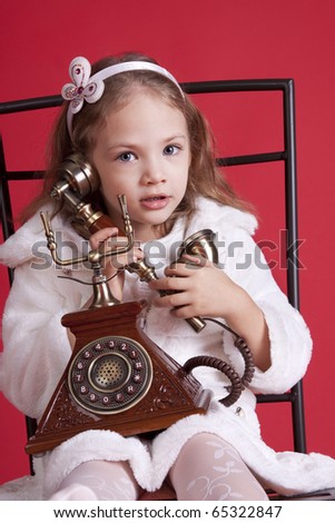 cute girl calling by old phone