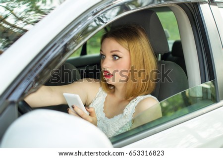 Young girl, holding phone in hand looked directly, creating an emergency situation