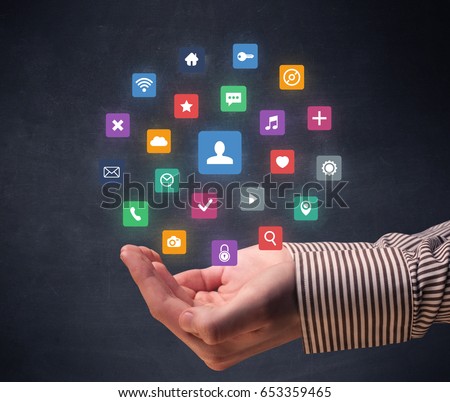 Colorful applications hovering over young hand