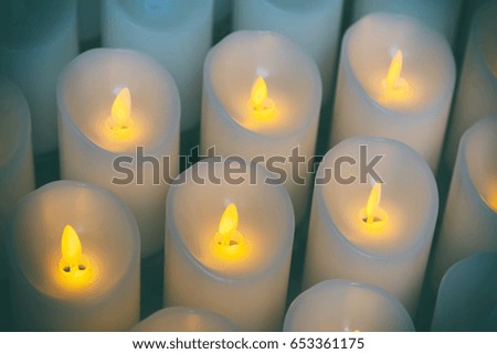 Candles light background of candles group In church