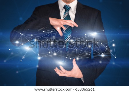 Businessman with network connection concept between his hands 
