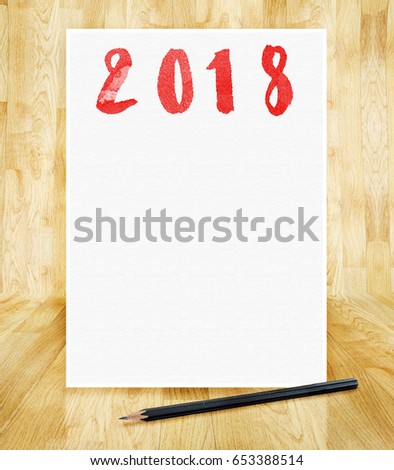 Happy new year 2018 on white paper frame with pencil in hand brush style in wood parquet room,Holiday greeting card,mock up for adding design or text