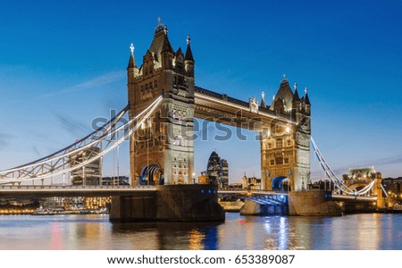 Financial District of London and the Tower Bridge at sunset, England.