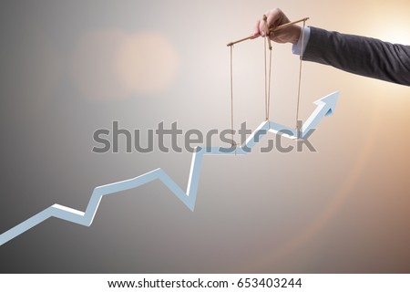 Businessman keeping the growth in economy Royalty-Free Stock Photo #653403244