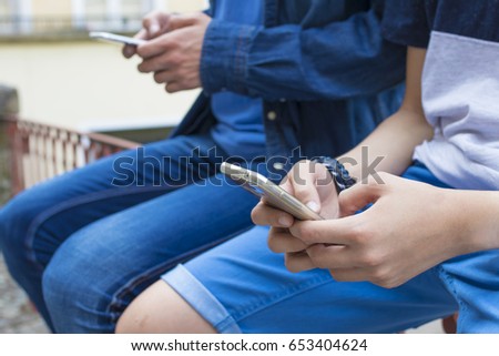 hands of young people with telephone mobile