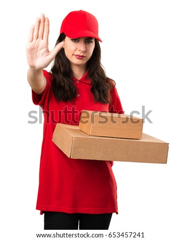 Young delivery woman making stop sign