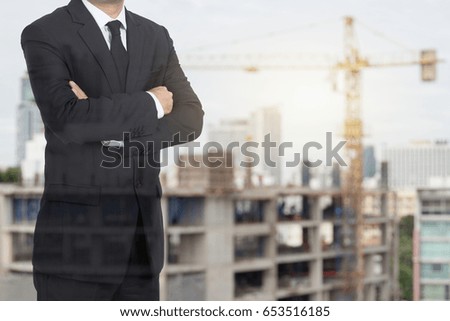 Smart  Architect , engineer boss stand on city Building construction site background