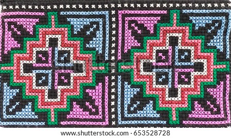 Ethnic pattern. Classic pattern from hill tribe embroidery. pattern in native hill tribe style in aquatic blue on coin purse or smartphone purse, popular souvenir texture surface