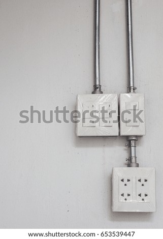 electric plug circuit on concrete wall background.