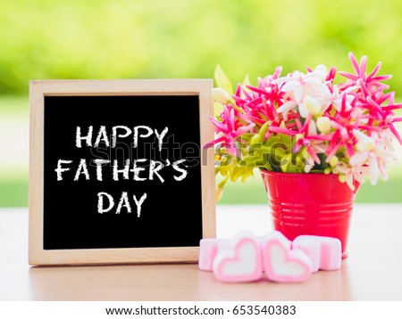 Father's Day concept. Poster mock up template with Happy father's day text and flower bouquet, marshmallow in the shape of heart and books over green background