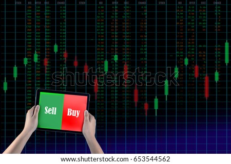 Holding tablet to show screen sell or buy isolated with background stock market graph run number chart, business investment and risk  exchange background.