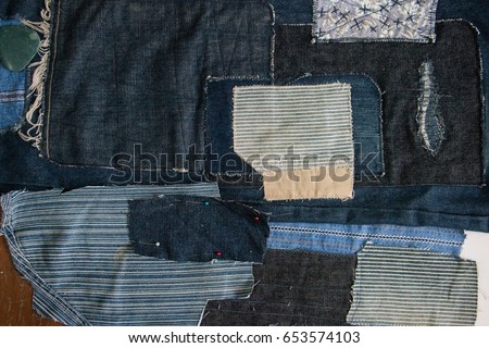 Technicians are doing genes in Japanese style. The work will come out as a tailor cut into a sewing together called a roo. Use cotton denim with blue indigo, yellow brown, red perfectly.