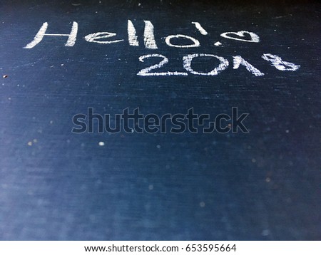 concept 2018 chalkboard. hello 2018. 2018 handwritten on scratched blackboard or chalkboard. 