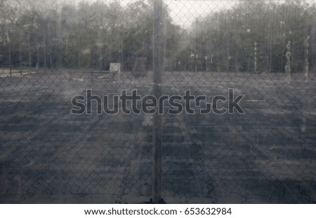 Sports field on a rainy day - view through the window