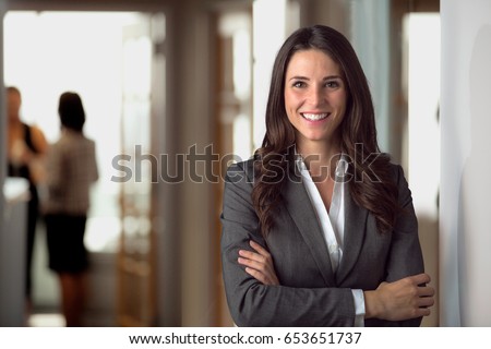 Happy smiling ceo manager at office space, possibly real estate, lawyer, non-profit, marketing Royalty-Free Stock Photo #653651737