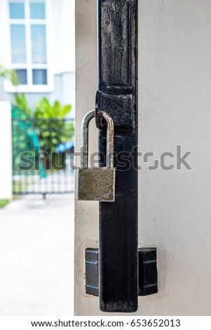 Old Master Key locked on home iron gate