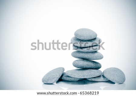 a pile of zen stones on a vignetted background
