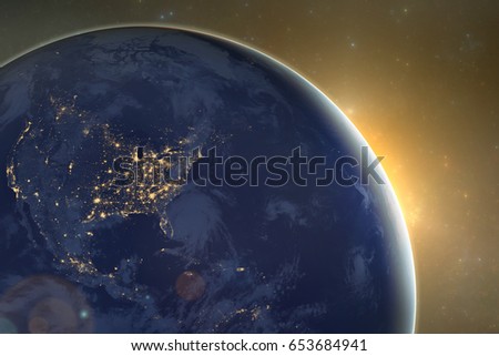 Dark side of the planet Earth with the rising Sun. Elements of this image furnished by NASA