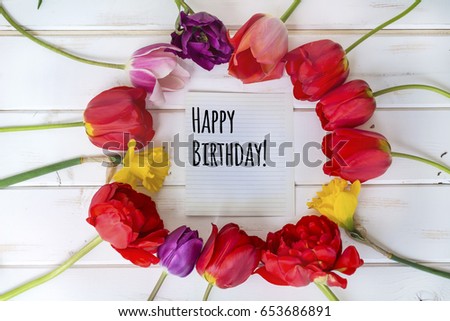 tulips flower on table with happy birthday message
