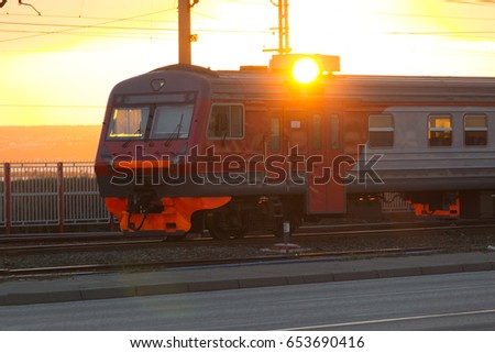 Railway tracks and overhead lines at sunset,