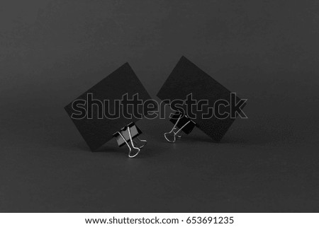 Photo of black business cards. Dark template isolated on black background. For graphic designers presentations and portfolios. Business card mock-up black on black.