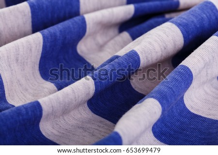 Natural cotton fabric in a blue gray strip.