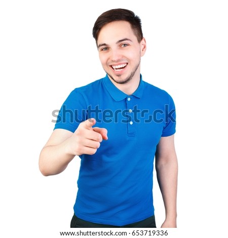 Portrait of a handsome young man pointing finger at you against white background. angry attractive young man pointing a finger towards you