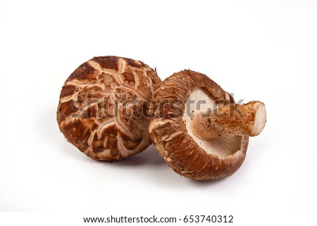 Fresh Shiitake mushroom  isolated on white background. Royalty-Free Stock Photo #653740312