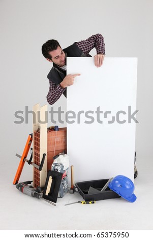 Worker pointing a sign on white background