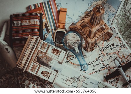 Overhead view of traveler's accessories. Grain stylized photo