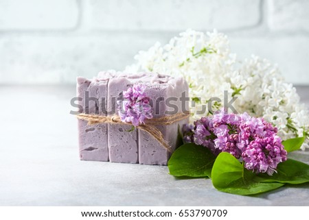 Natural handmade soap and lilac flowers. Selective focus